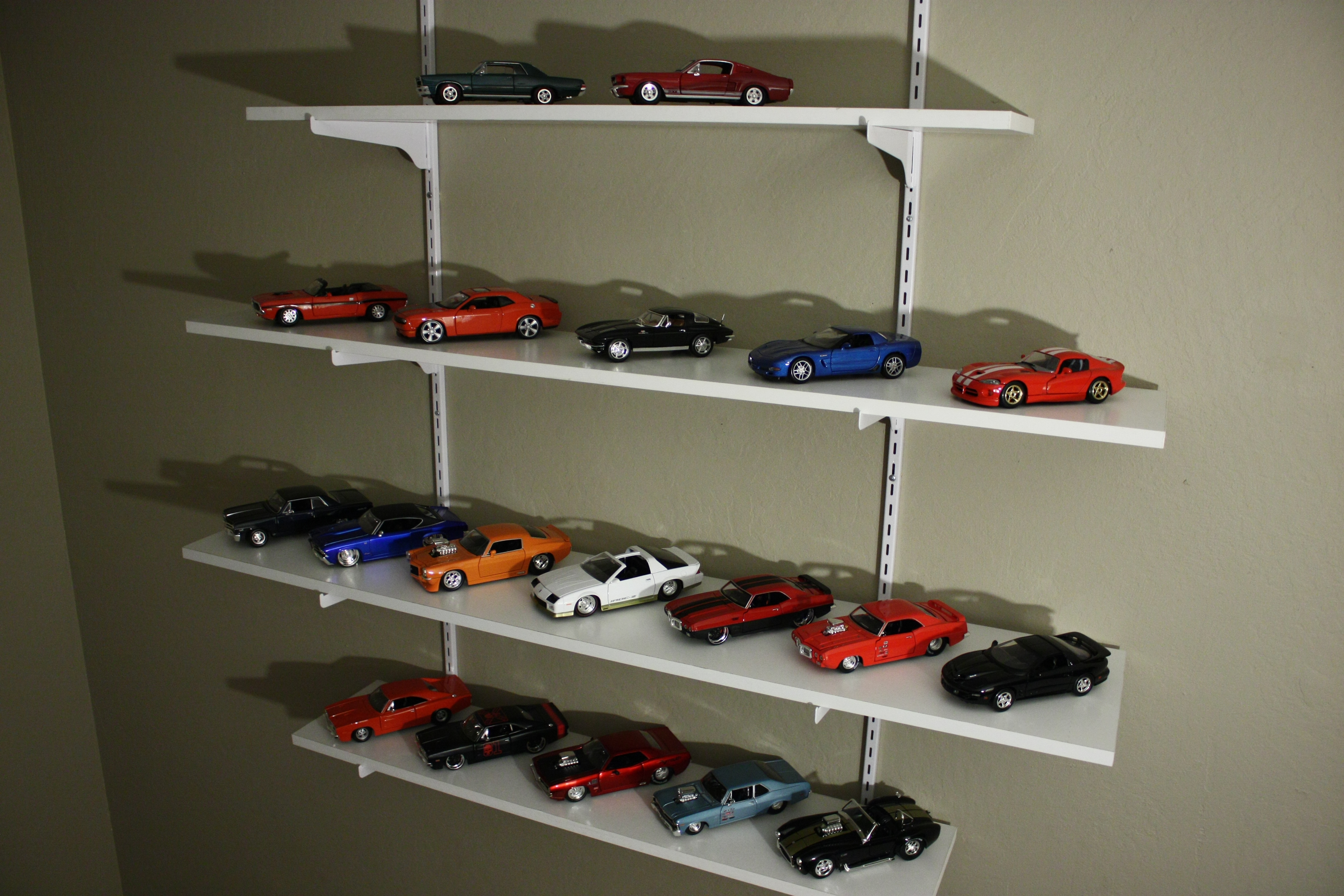 Diecast model cars in 1:64, 1:43 and 1:18 scales compared